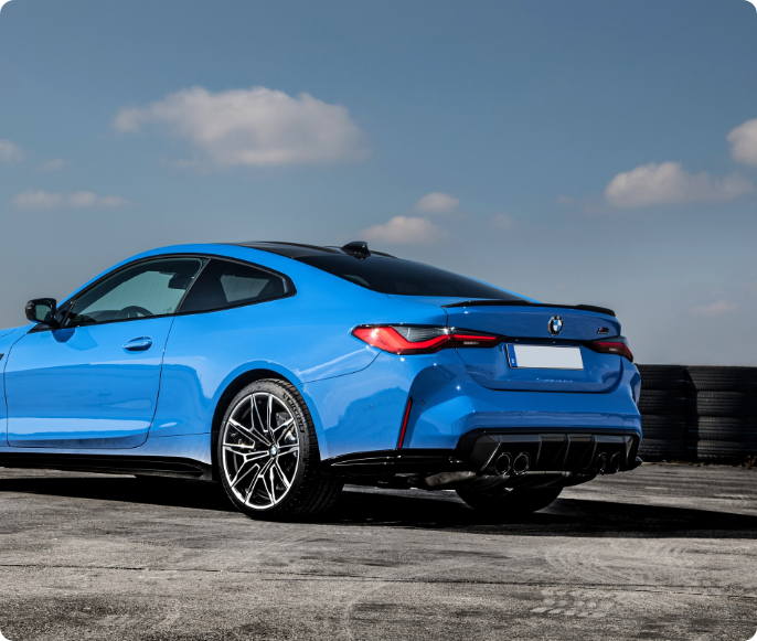 Finesse A commitment to excellence. Finesse | An outside shot of one our blue BMW's