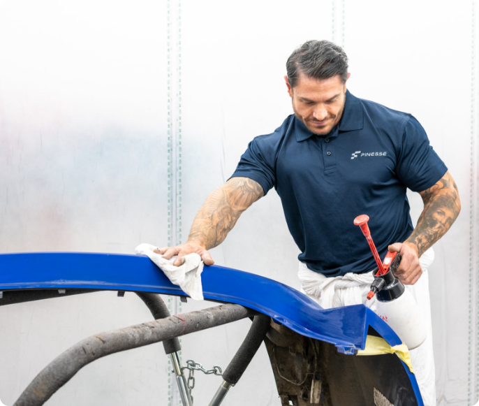 Finesse Careers Image Finesse | Image of one of our members of staff working on a vehicle chasis