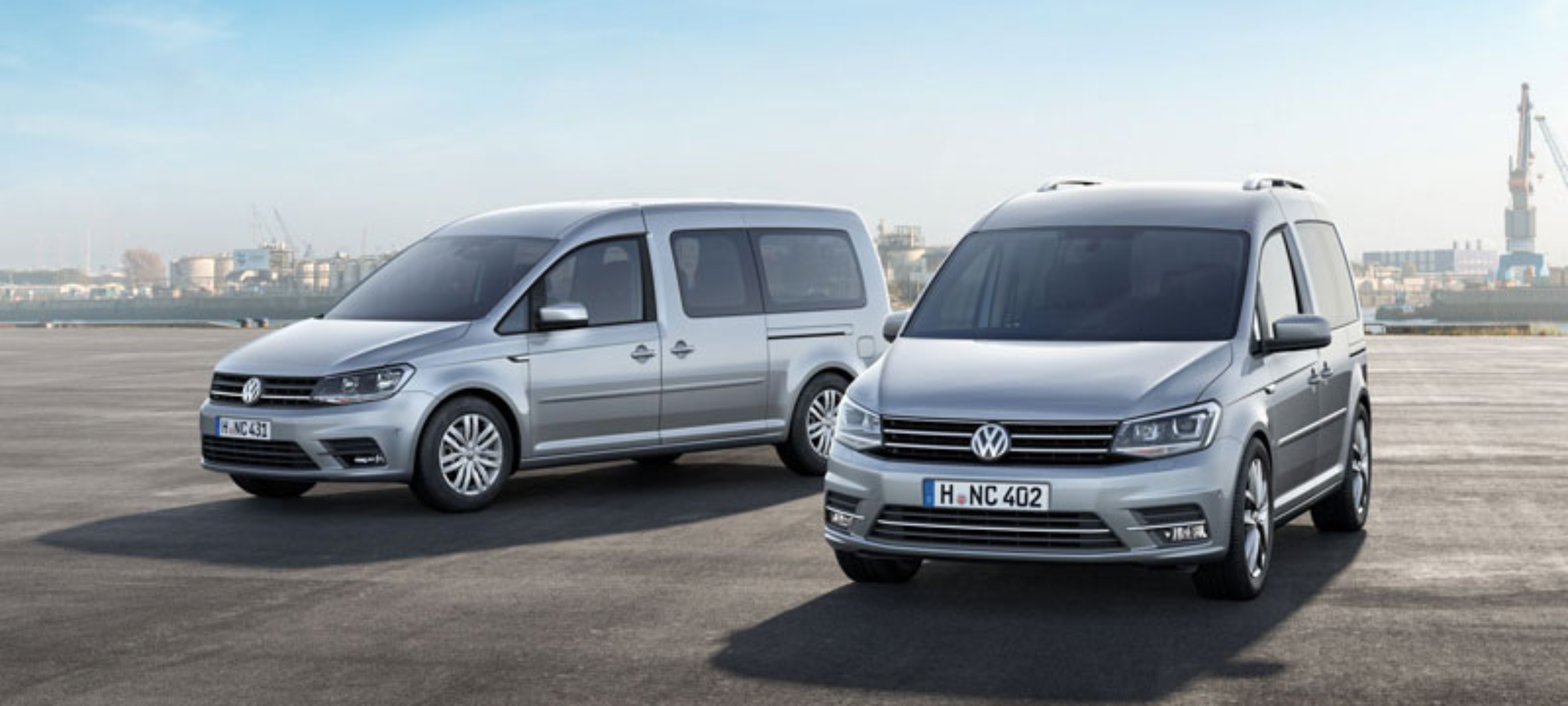 Stock VW small vans Finesse | an image of a Volkswagen parked on the road with a sunset in the background