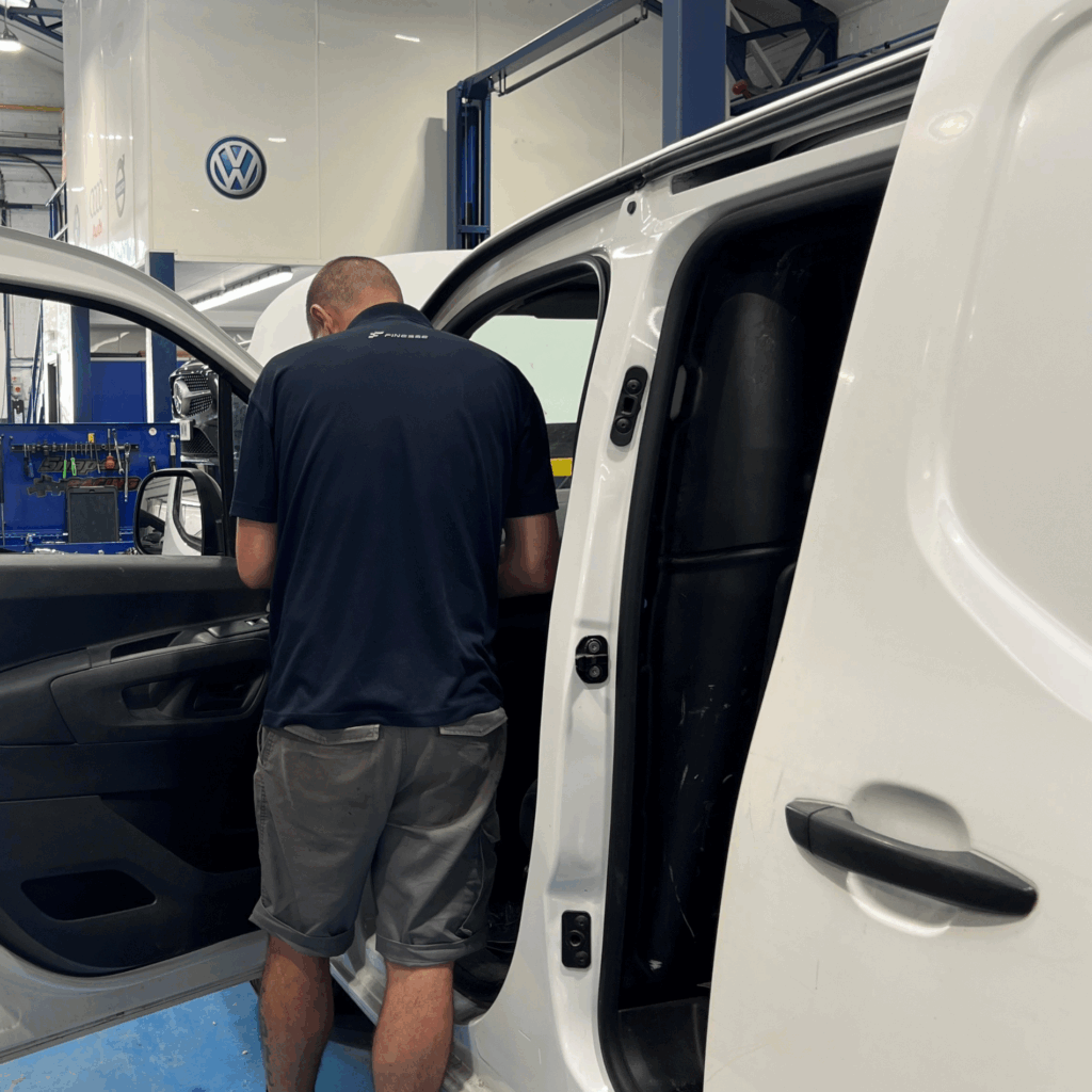 volkswagen _van_finesse A technician repairing a van at Finesse approved Volkswagen body shop