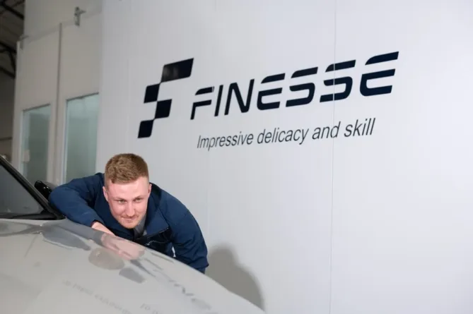 Finesse | an image showing a member of staff working on a vehicle