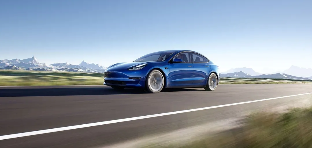 Finesse Tesla Approval Image Finesse | An image of a Tesla driving along a road