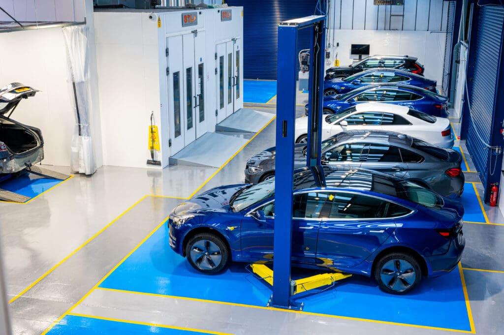 The image shows cars at Finesse ARC, a manufacturer approved accident repair centre