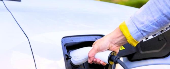 A person charging an AION vehicle