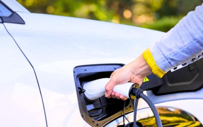 A person charging an AION vehicle